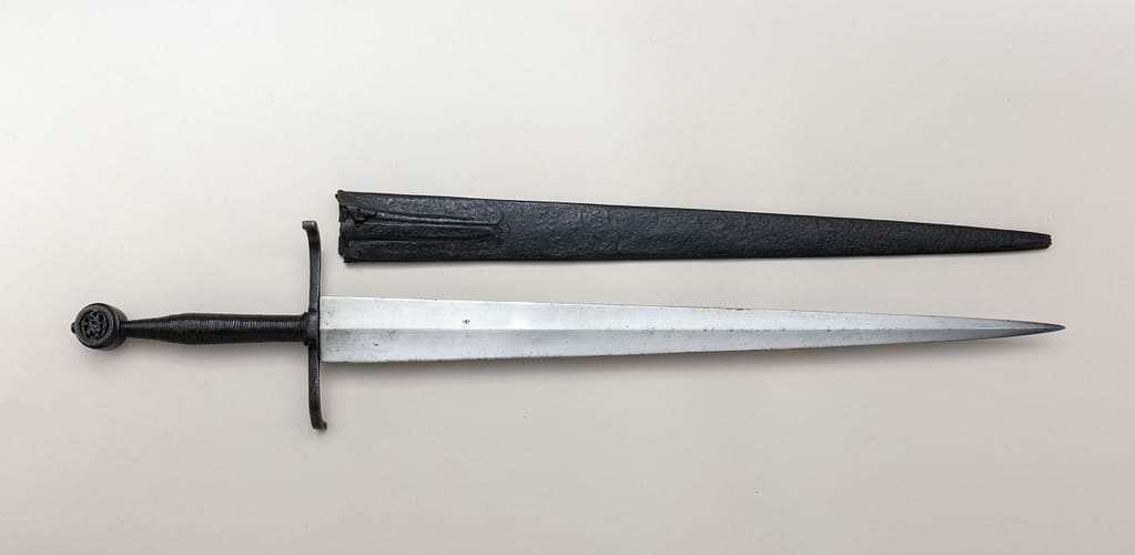 Photography of a surviving historical longsword with scabbard from ca 1450 - 75.The sword itself is probably from northern Italy, but this could have also been a German longsword.